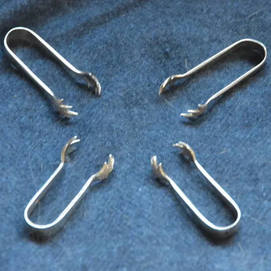 TWO PAIRS OF SILVER TONGS 1907