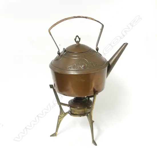 An Arts & Crafts copper spirit kettle on brass stand