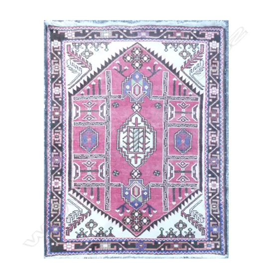 A Turkish hand knotted wool rug
