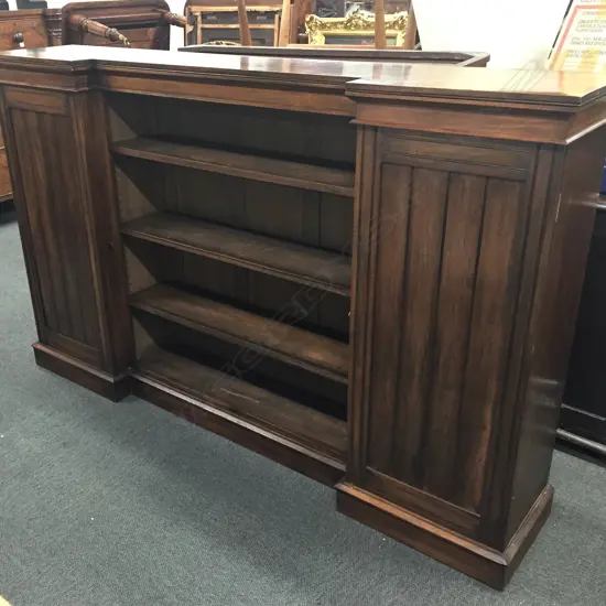 A late Victorian walnut breakfront bookcase cabinet