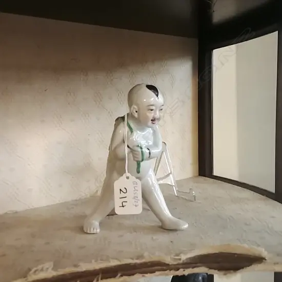 ORIENTAL PORCELAIN FIGURE OF A YOUNG BOY WITH CARP