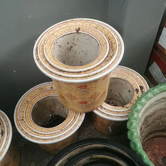 3 SETS OF 3 GRADUATED YELLOW PLANT POTS (9)