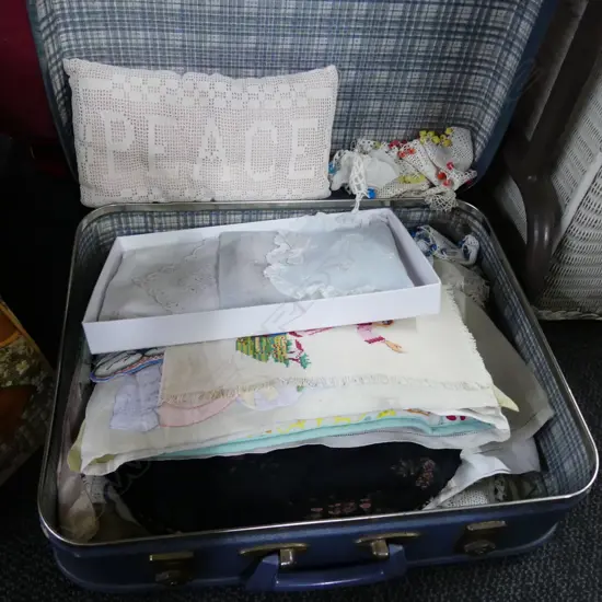 SUIT CASE LOT OF DOILIES/ TEA COSY COVERS