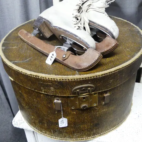 ROUND HAT BOX; ICE SKATES INSIDE