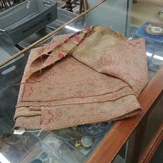 A VINTAGE JACQUARD-WOVEN PAISLEY SHAWL