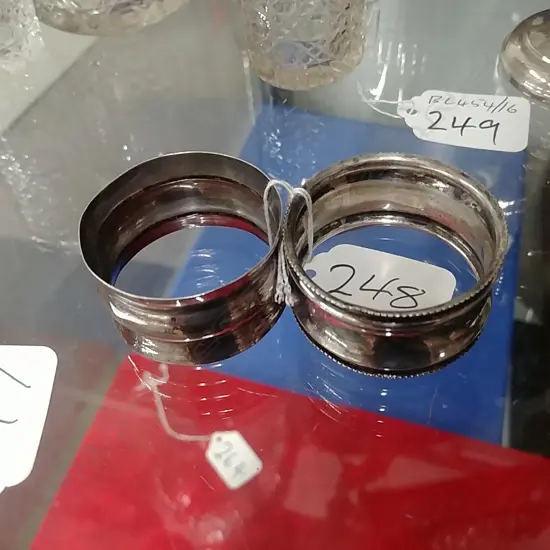 TWO SILVER NAPKIN RINGS