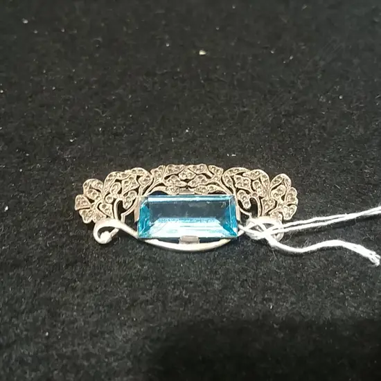 SILVER MARQUSITE BROOCH WITH BLUE STONE