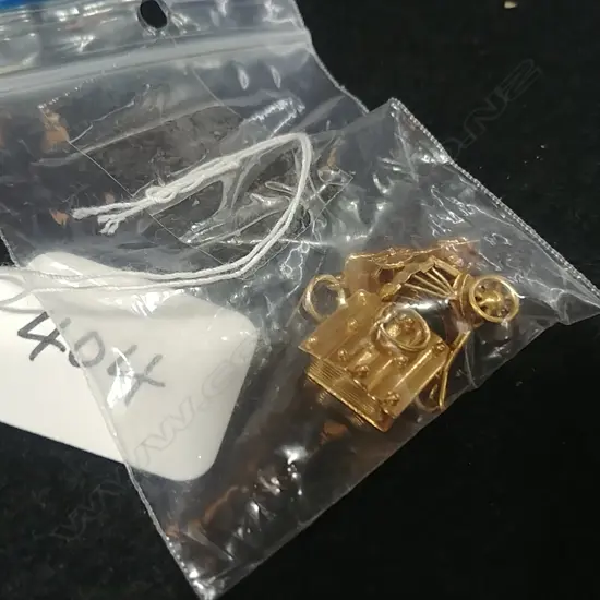 3 GOLD CHARMS MARKED 18 AND 14 CT ONE UNMARKED