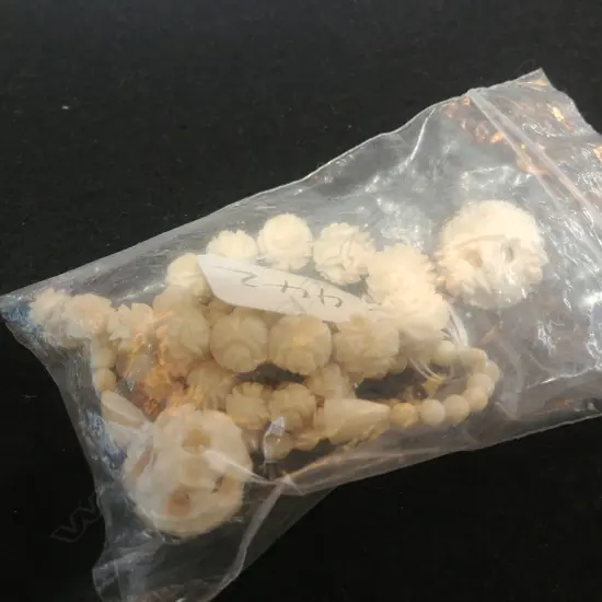 IVORY NECKLACE AND TWO BALLS