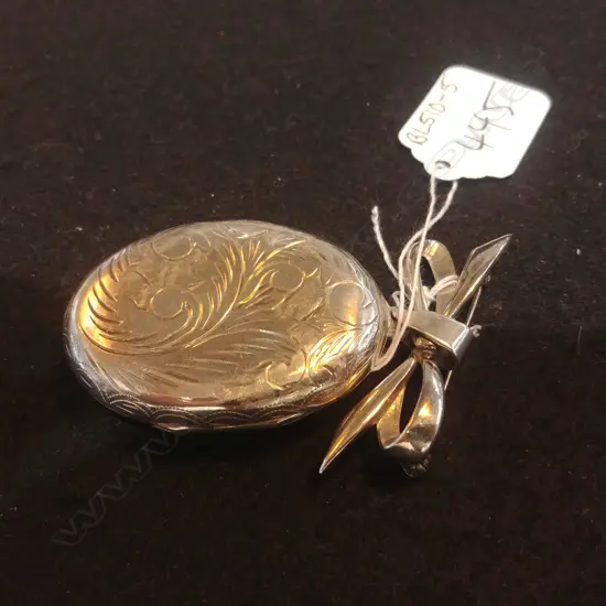 SILVER LOCKET ON BOW BROOCH