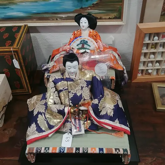 2 JAPANESE SEATED DOLLS + 6 PAINTED WOODEN EGGS