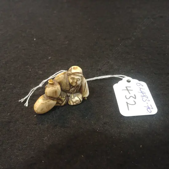 JAPANESE CARVED IVORY NETSUKE MAN & GOURD