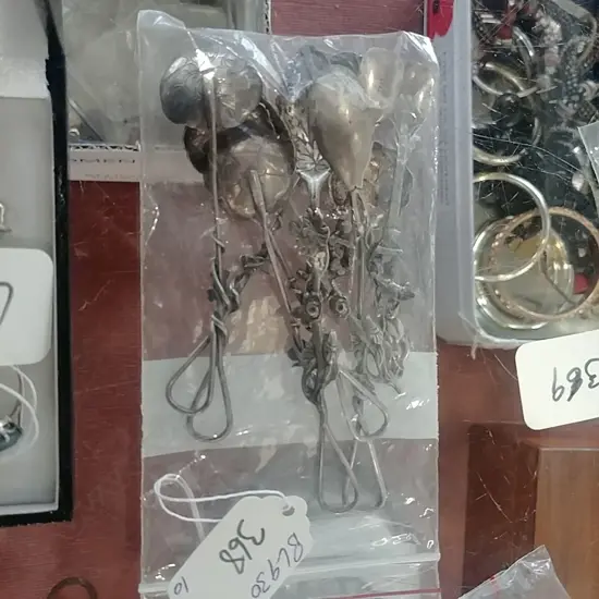 10 SMALL FANCY SILVER SPOONS