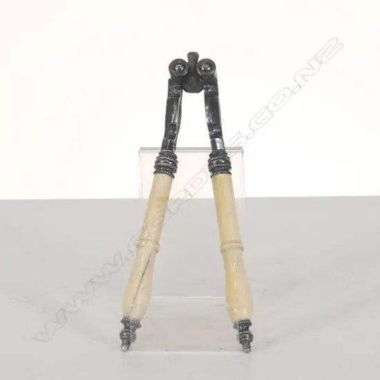 A PAIR OF IVORY HANDLED NUT CRACKERS