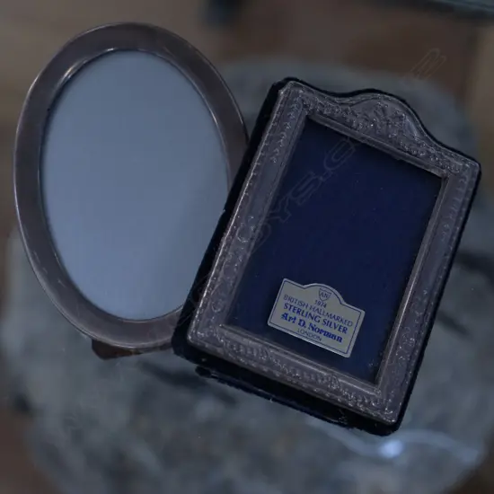 2 SMALL SILVER PHOTO FRAMES 