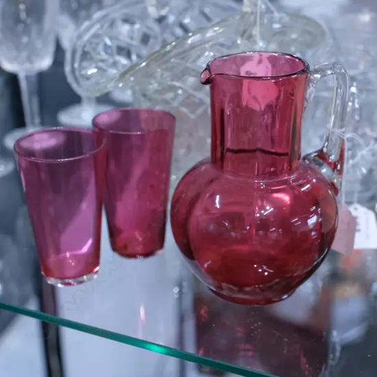 RUBY GLASS JUG AND 2 BEAKERS H. 140MM