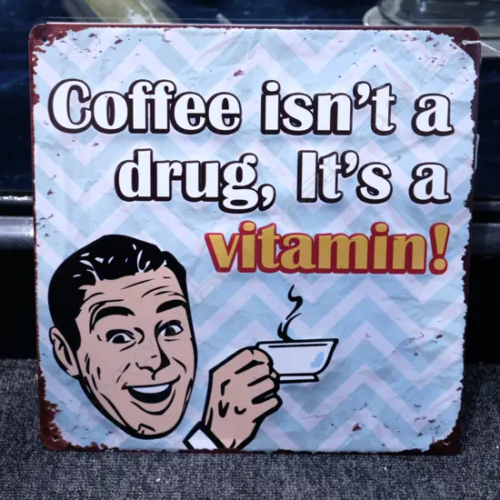 OLD STYLE TIN SIGN 'COFFEE ISN'T A DRUG IT'S A VITAMIN H.300MM W. 300MM
