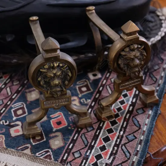 PR BRASS FIRE DOGS DECORATED W/ LIONS H. 210MM