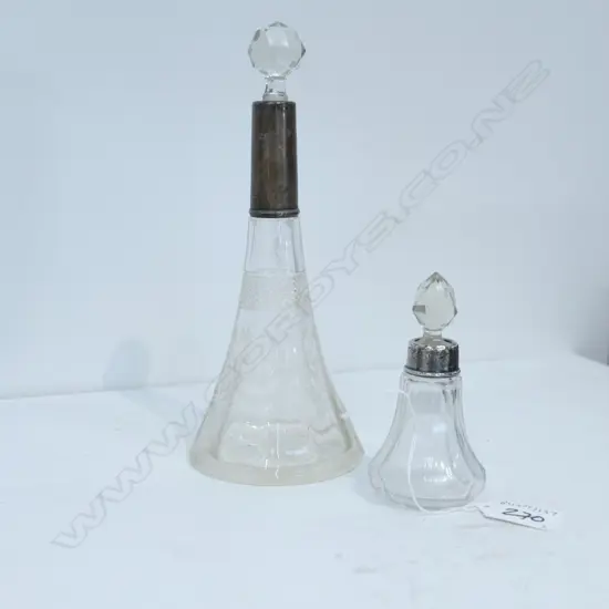 2 S/S TOPPED DRESSING TABLE BOTTLES. LARGEST H. 215MM