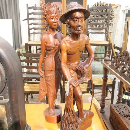 TWO LARGE ASIAN CARVED WOODEN FIGURES, A MAN AND A WOMAN