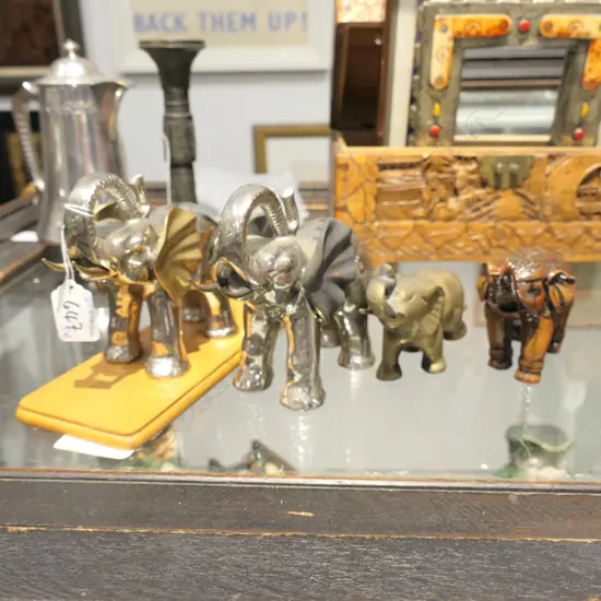 4 ELEPHANT FIGURINES