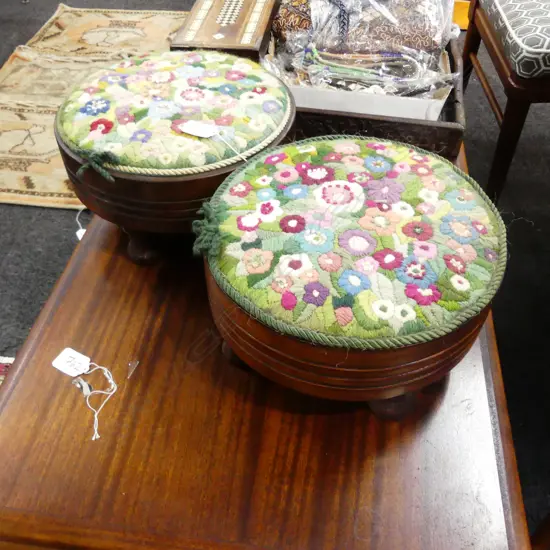 PAIR OF CIRCULAR NEEDLEPOINT FOOTSTOOLS