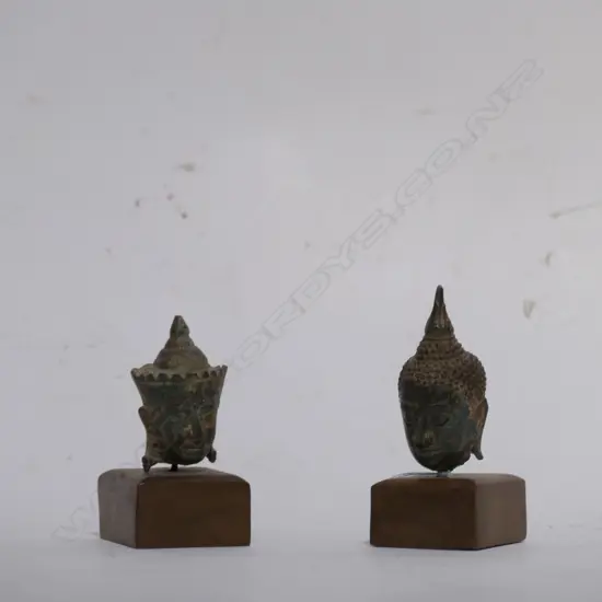 TWO SMALL VINTAGE BUDDHA HEADS ON STAND