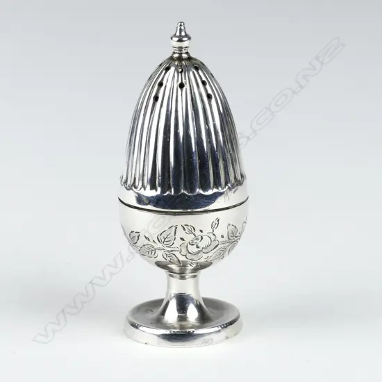 A small silver pepperette on stand