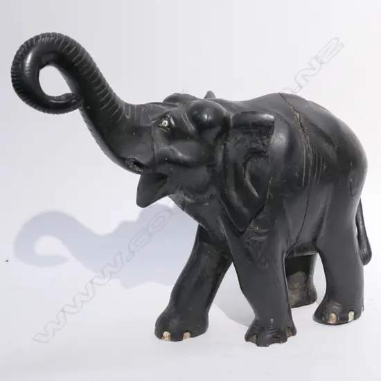 CARVED EBONISED ELEPHANT. SOME FAULTS H. 450MM