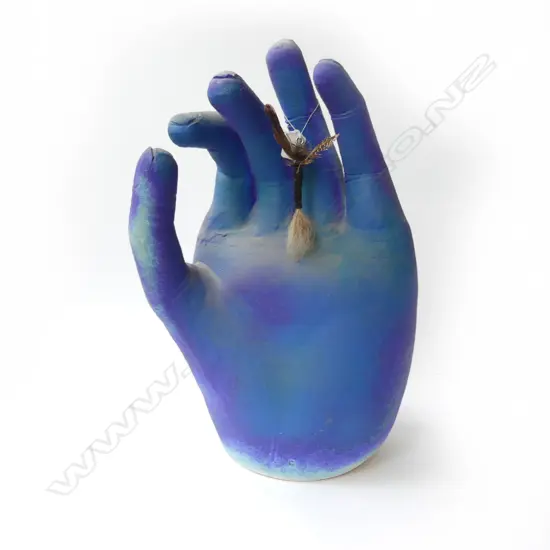 Paul Laird large pottery hand supporting an extra-large fisherman's wet fly