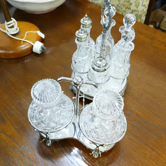 TWO CRUETS WITH GLASSWARE