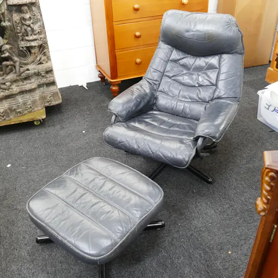 LEATHER ARMCHAIR AND OTTOMAN