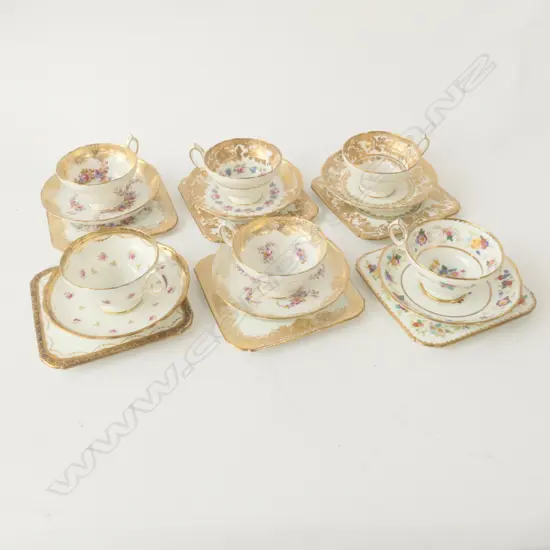 SIX MIXED GILT AND FLORAL HAMMERSLEY TRIOS