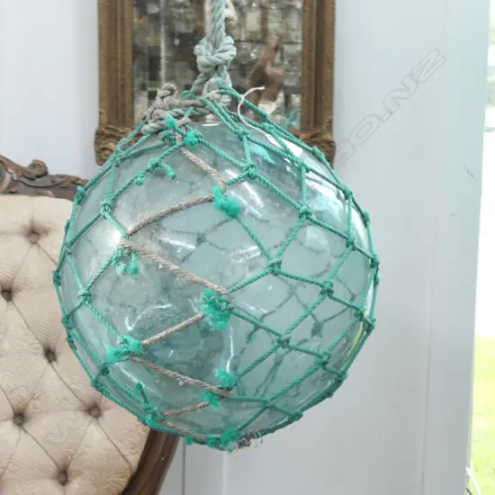 OLD GLASS FISHING FLOAT WITH NETTING...