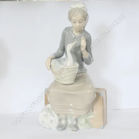 NAO GIRL WITH GOOSE IN BASKET H 260 MM