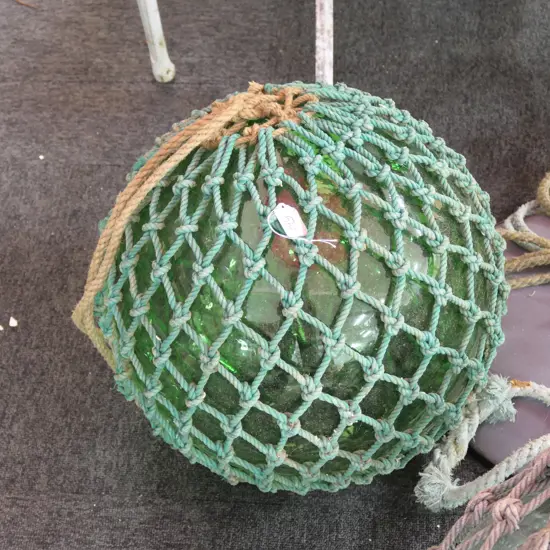 OLD LARGE GLASS FISHING FLOAT WITH NETTING...