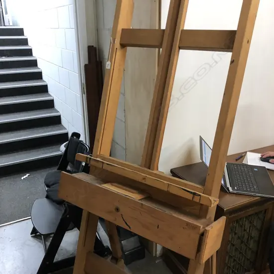 ARTIST EASEL AND BLACK STOOL