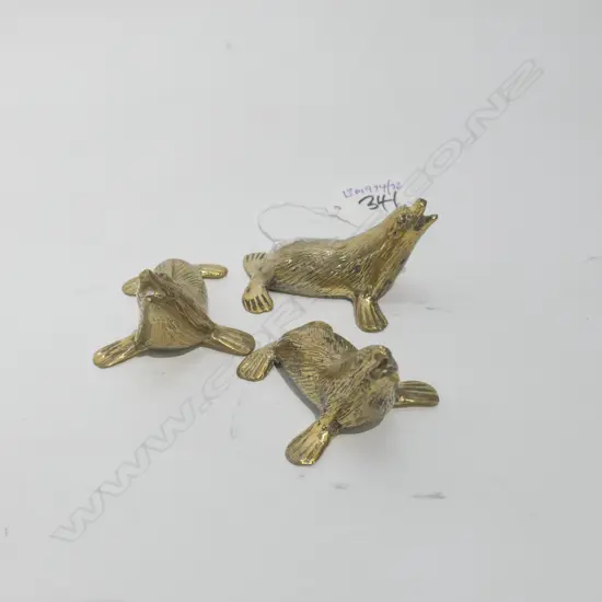 3 CAST POLISHED BRONZE SEALS L 70 MM