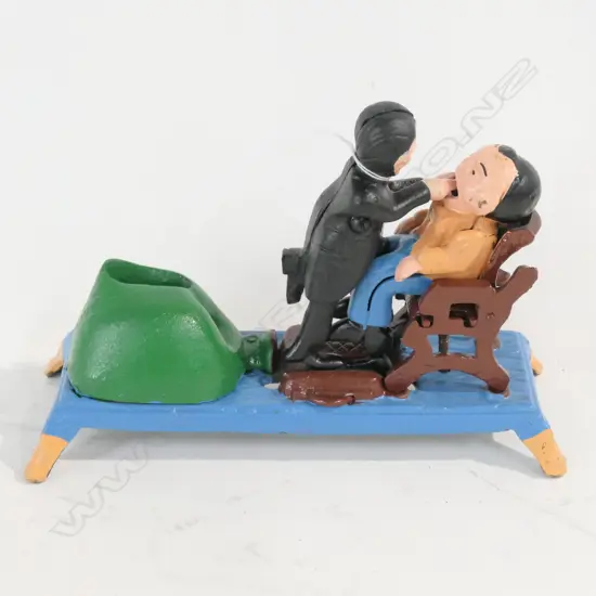 REPRODUCTION CAST IRON DENTIST TOY