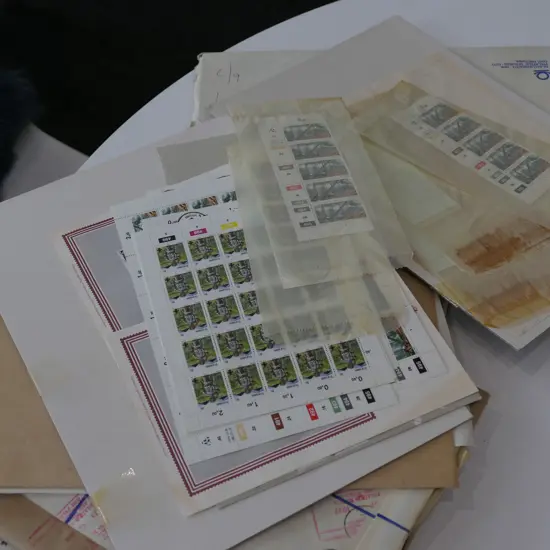 FOUR FOLIOS OF SOUTH AFRICAN STAMPS