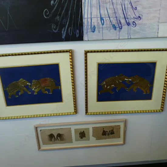 A PAIR OF FRAMED GILDED ELEPHANT PRINTS