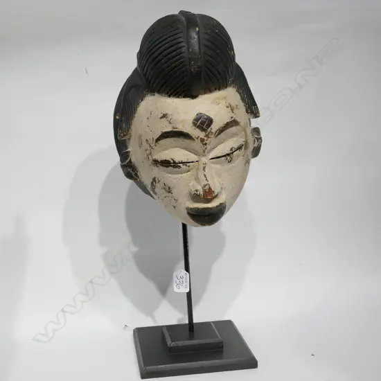 TRIBAL CARVED WOODEN MASK ON STAND H. 530MM