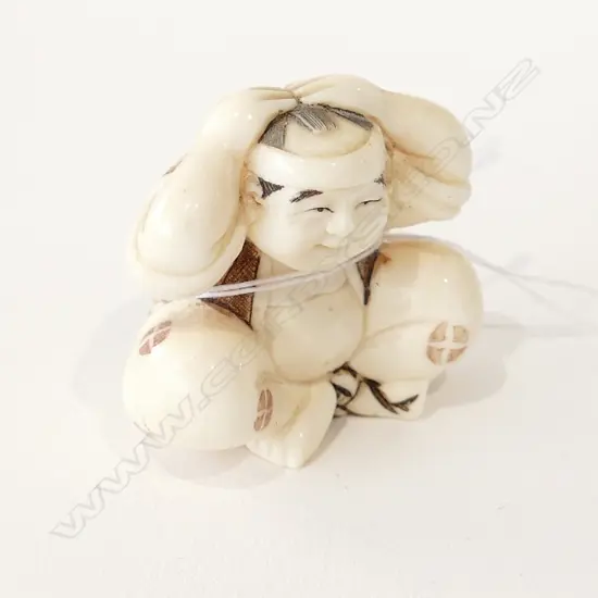JAPANESE IVORY NETSUKE BOY HANDS TO HEAD