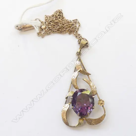 9CT GOLD CHAIN AND PURPLE STONE & LEAF PENDANT