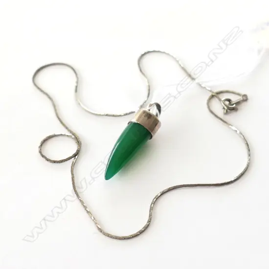 GREEN GEMSTONE TOOTH AND SILVER PENDANT