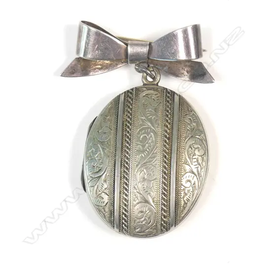 SILVER LOCKET ON BOW
