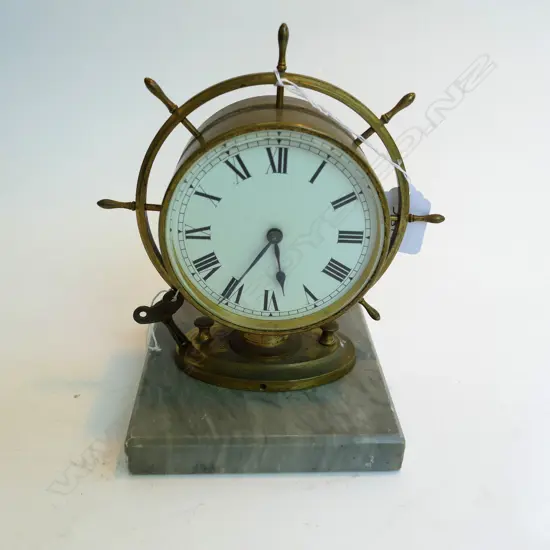 ANTIQUE BRASS CASED SHIPS WHEEL CLOCK ON MARBLE BASE W/ KEY