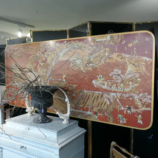 LARGE RED LACQUER PANEL DEPICTING ORIENTAL RIVER SCENE 2130 MM W X 915MM H