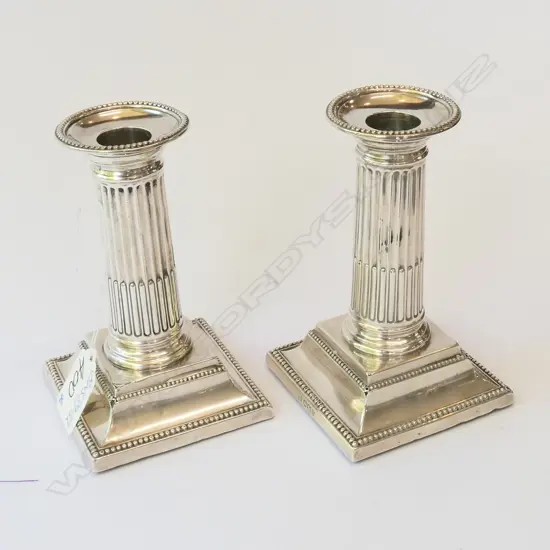 Pair silver candle stick holders square bases reeded weighted