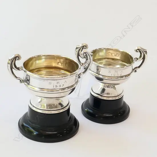 2 MINIATURE SILVER TROPHY CUPS ON STANDS